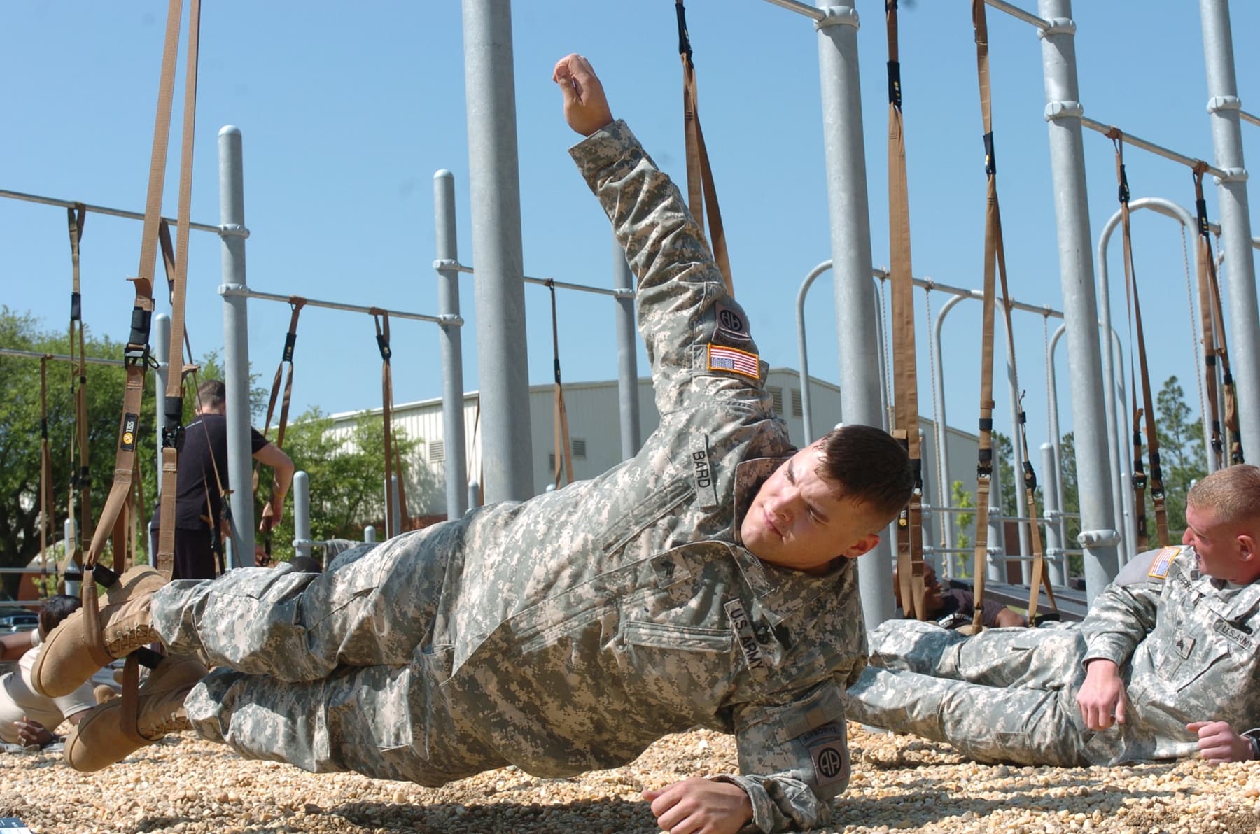 Person demonstrates a modified side plank on the elbow